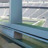 Stadium wall expansion joints in box suite window wall Seismic Colorseal DS EMSEAL