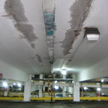 The photo illustrates vividly why expansion joints should be watertight at their top surface. And why gutters can lead to the need for seriously costly repairs. They underscore how gutters conceal leaks, resulting in structural damage that is dangerous and far more costly than the price of an expansion joint that works.