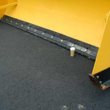rubber tipped snow plow for snow plowing expansion joints