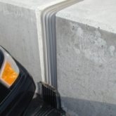 Continuity of seal between different expansion joint technologies is a hallmark of EMSEAL's. Here, Seismic Colorseal transitions to a sloped, sealed, THERMAFLEX upturn termination.