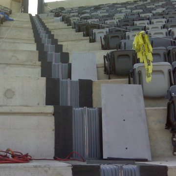 Continuity of seal from top of stadium to bottom of each seating level is assured with factory-fabricated SJS sections. Plates are seen at right ready for installation