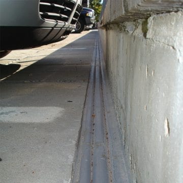 Deck to wall parking garage expansion joint DSM System from EMSEAL