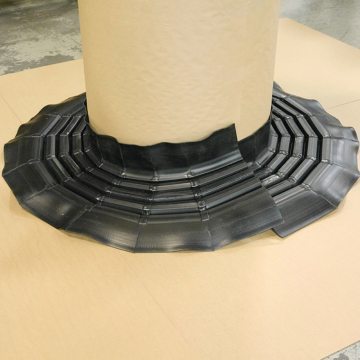 Custom 8-inch (200 mm) RoofJoint factory-welded to follow 3-ft diameter round roof penetration.