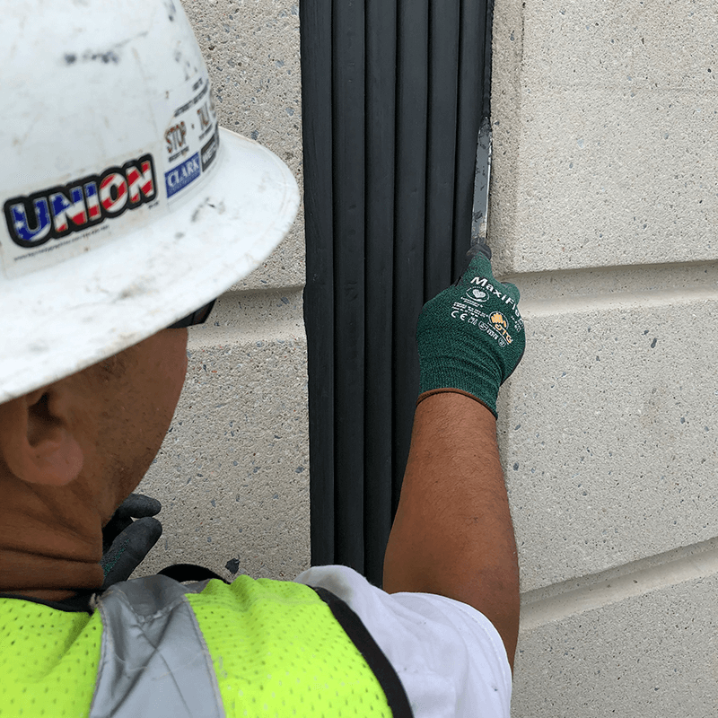 Once the Seismic Colorseal precompressed foam has expanded a bead of field applied silicone is tooled to ensure continuity of seal