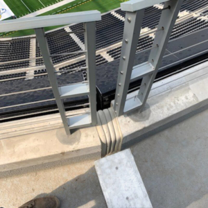 Seismic expansion joint cover transition over parapet wall at LA Rams SoFi Stadium by Sika Emseal